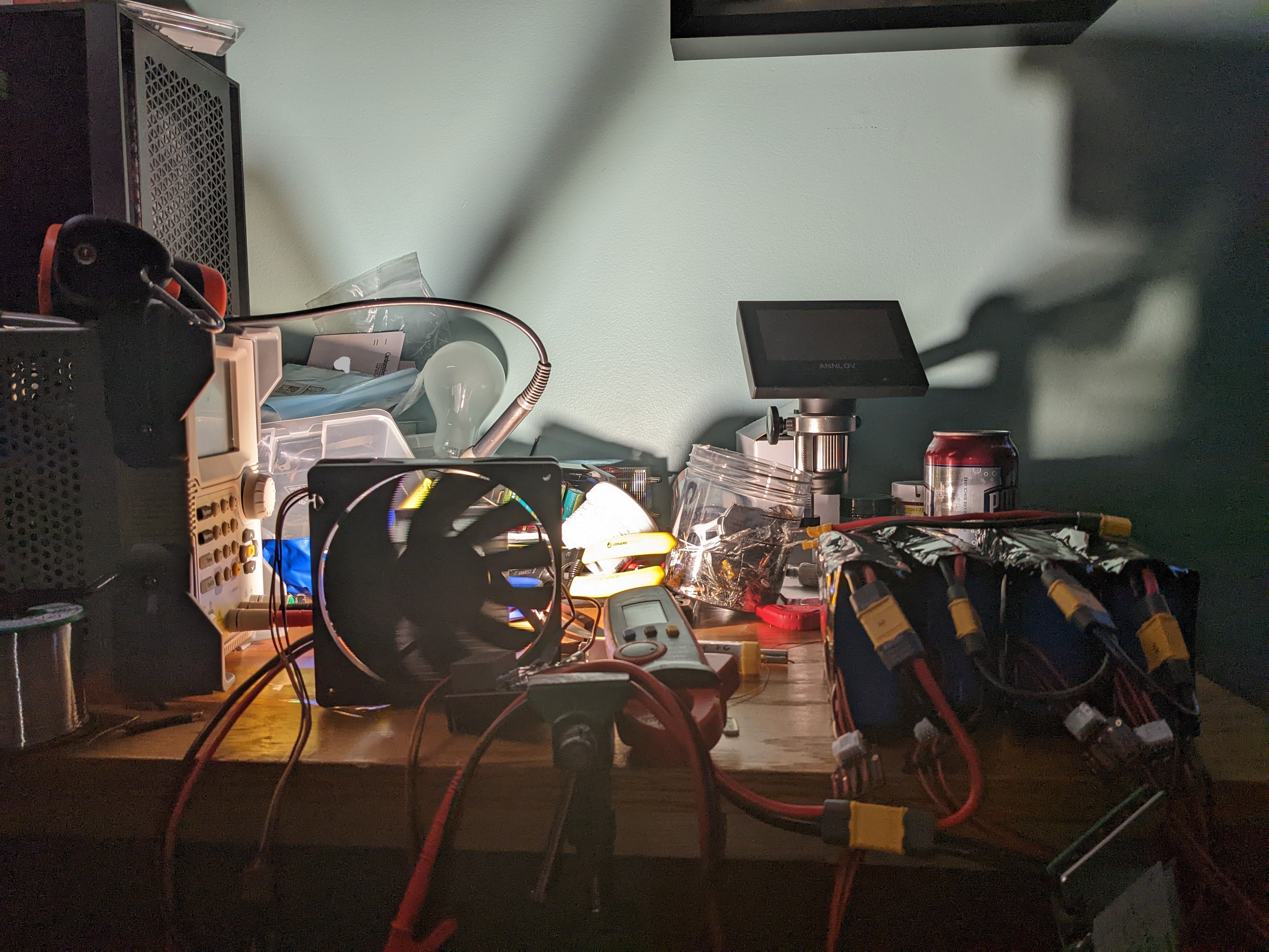 A high-power LED lights up a cluttered desk